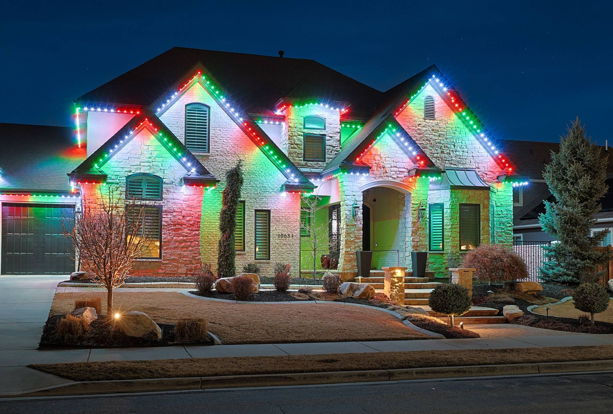 Home with multicolor holiday permanent lighting
