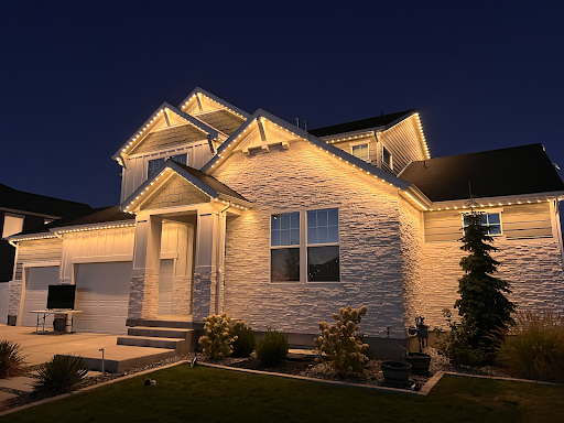 Craftsman home with warm white permanent roofline lighting