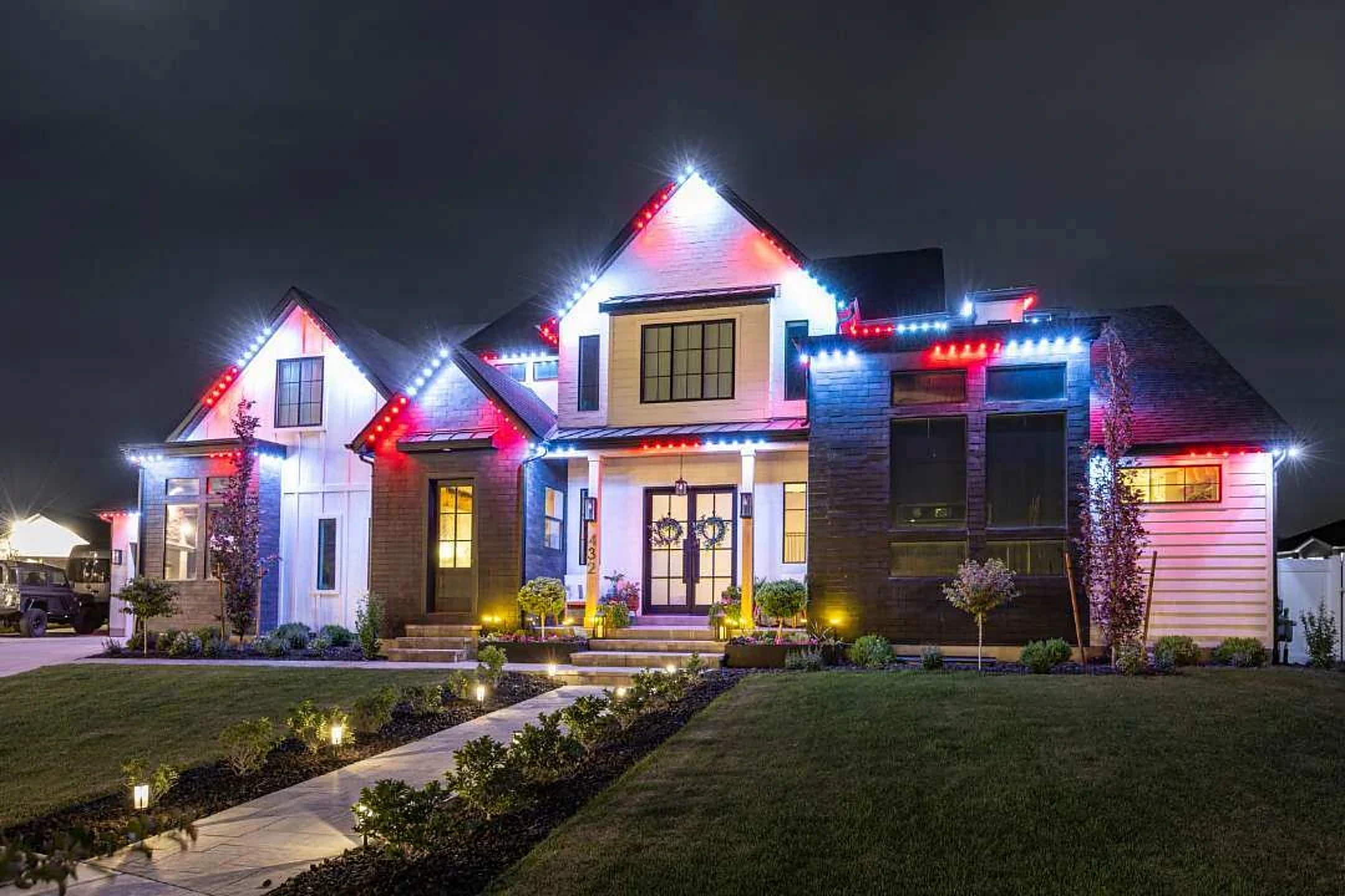 Modern farmhouse with red and white accent lighting